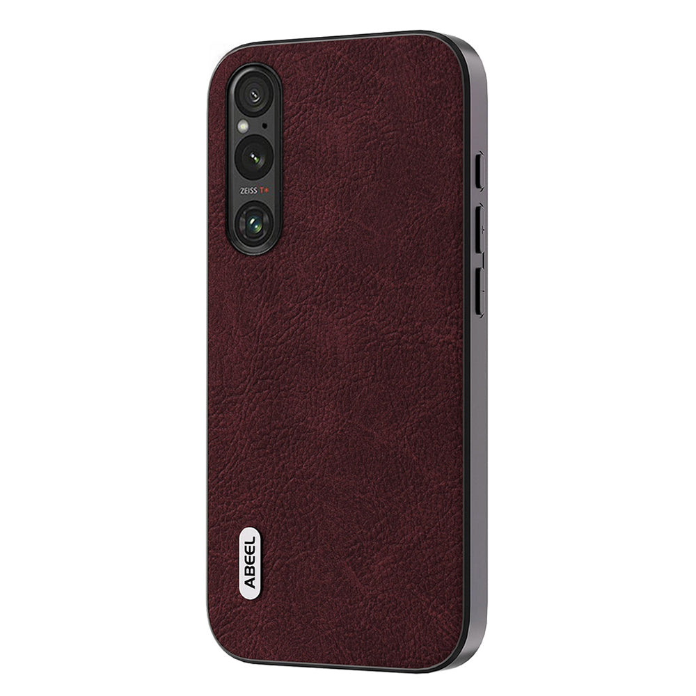 Uniqkart Slim Phone Case for Sony Xperia 1 V Shockproof Cover Litchi Texture PU Leather+PC+TPU Phone Shell - Purplish Red